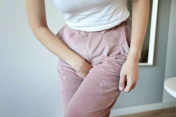 woman struggling with urine incontinence Chessington